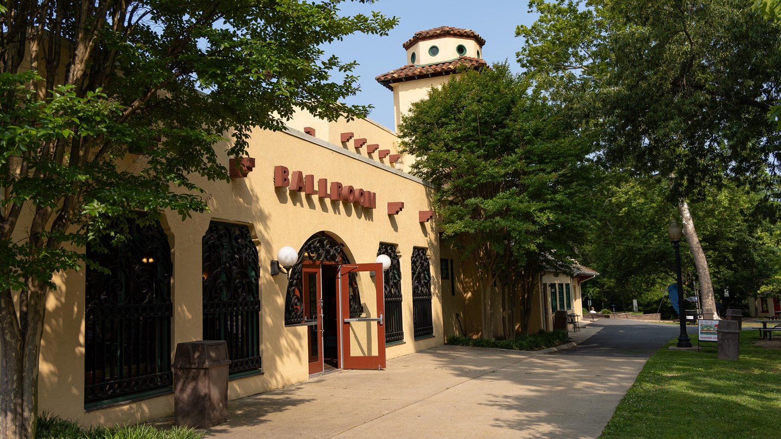 An ochre-colored building with Spanish mission-styled architecture.