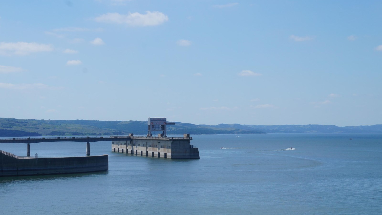 Fort Randall Dam station about the Missouri River. Blue sky with clouds and blue water. 