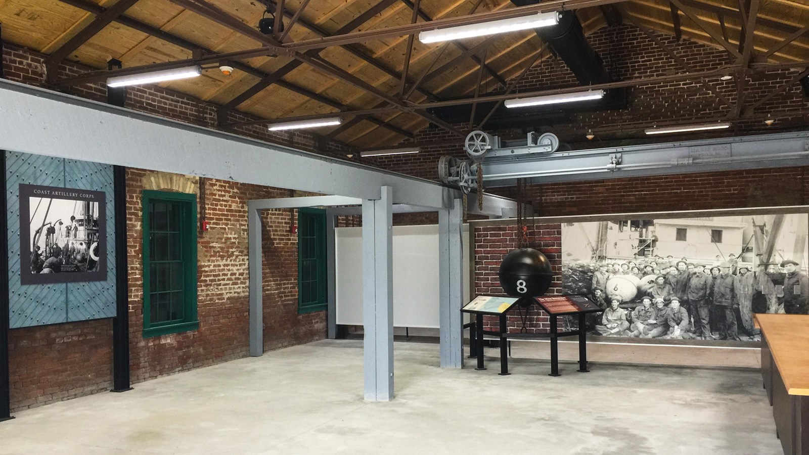 Exhibits about the mine storeroom line the walls with a wide open concrete space in the middle.