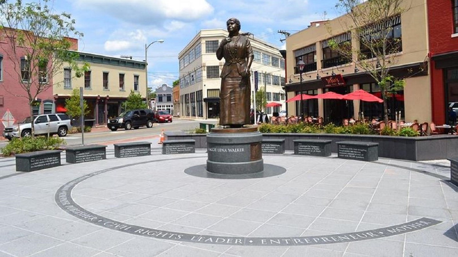 The Maggie L. Walker Memorial Plaza is an open area with a statue and benches honoring Mrs. Walker