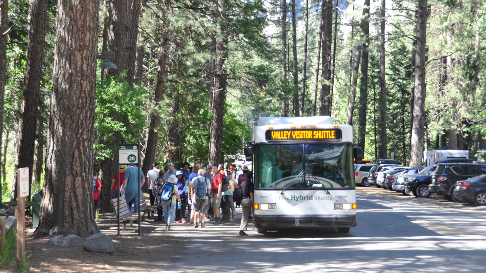 Bus at stop picking up group of visitors