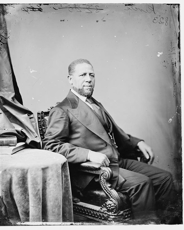 An African American man in a formal portrait. 