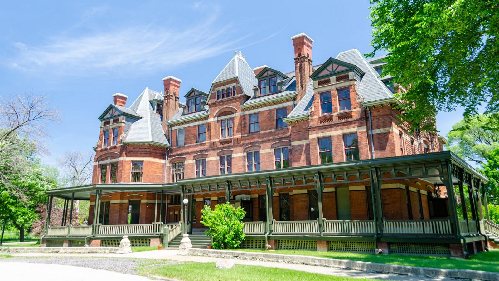 The exterior of the Hotel Florence. A red brick, four story, Victorian style building
