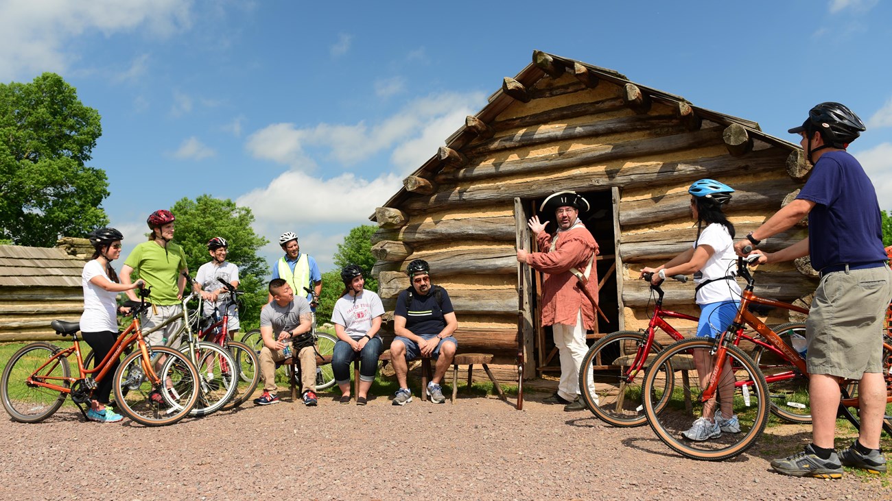 outdoors, tour group, bicycle, log cabin