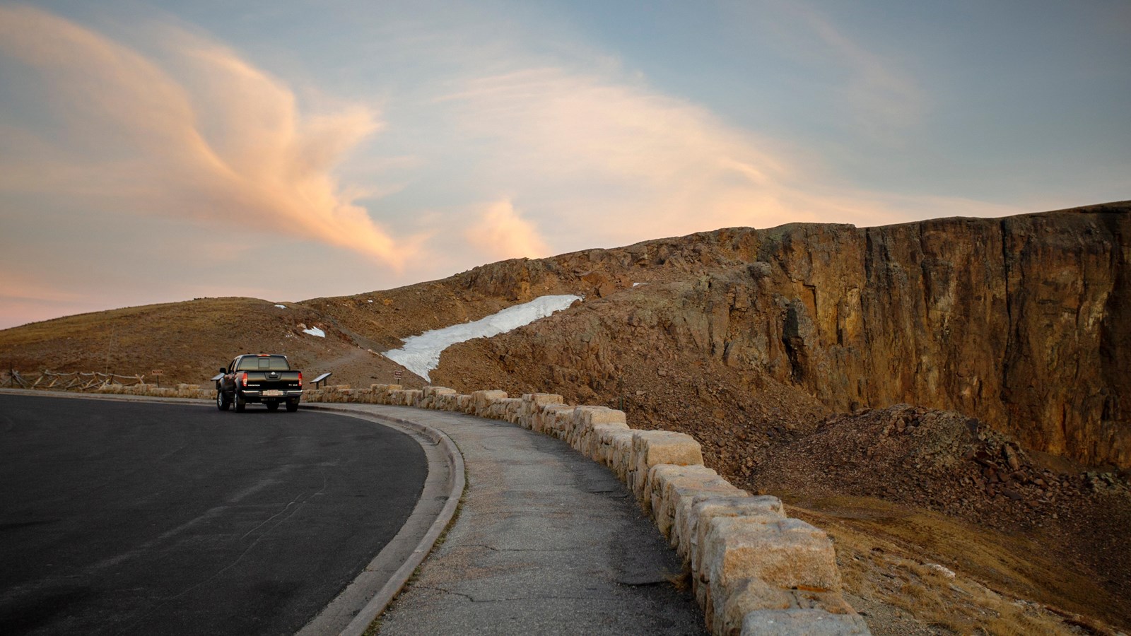 view of rocky cliff face from the road
