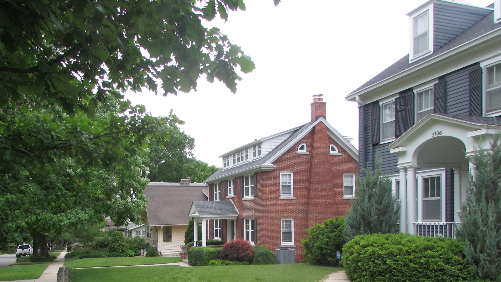 Historic homes with deep set-backs and tree lined, curvy streets.