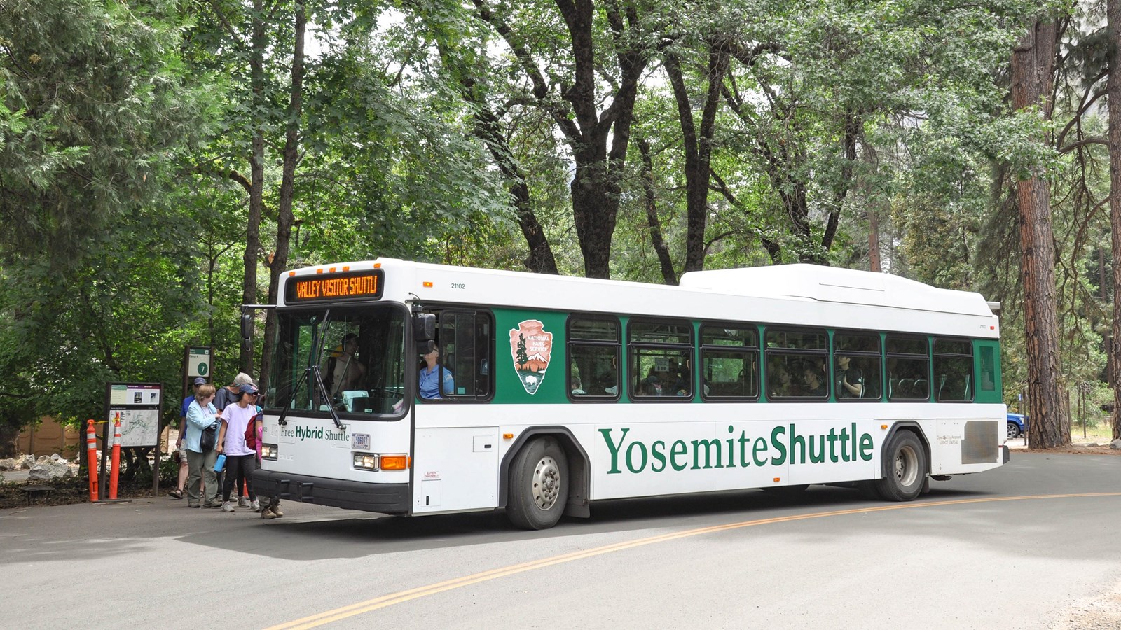 Bus at stop with people loading