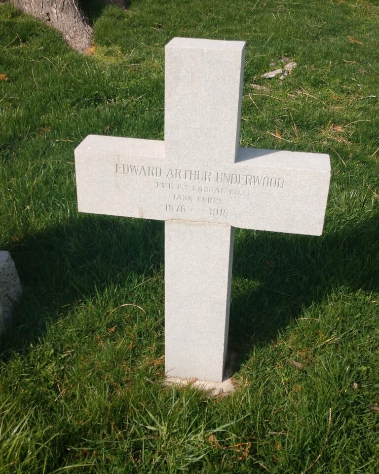 A white cross headstone for Private Edward A. Underwood