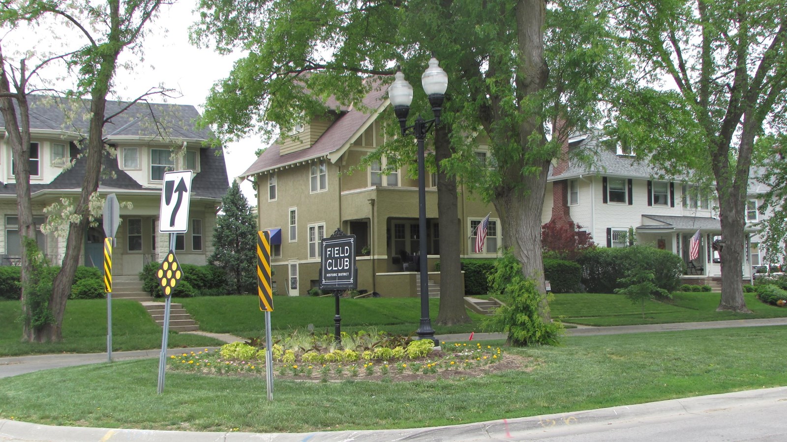 Various styles of historic homes with deep set backs, tree lined streets, facing boulevard.