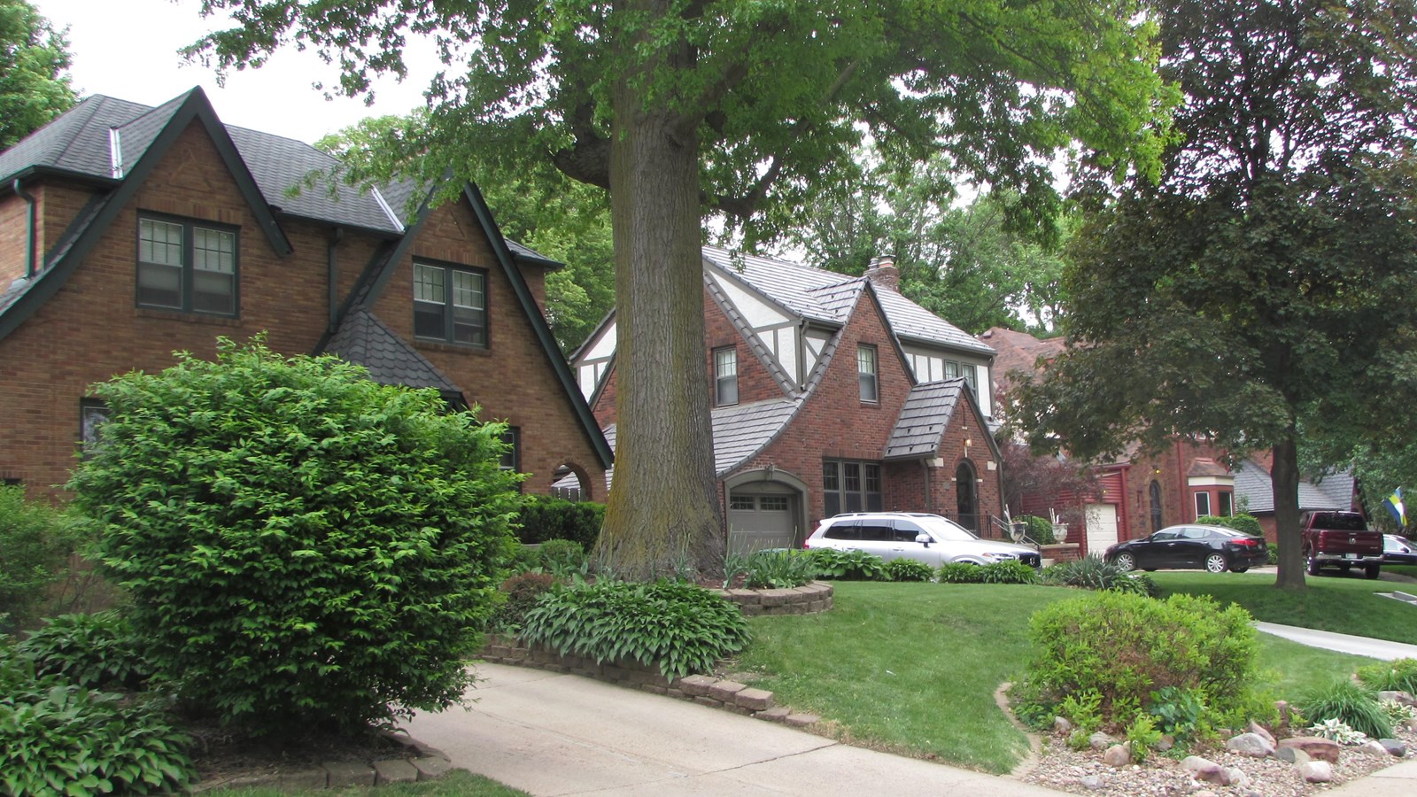 Brick, tudor homes with deep setbacks, landscaped lawns, and tree lined winding streets.