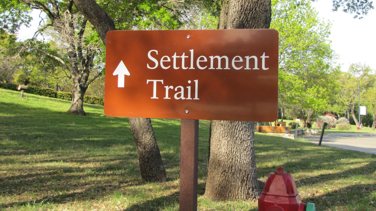 On a brown sign is the text 