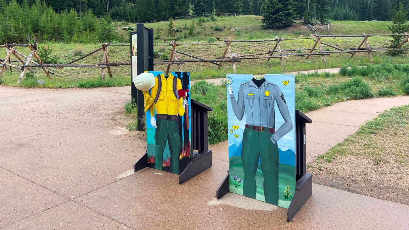 Two wooden cutouts where Junior Rangers can take a photo like a park ranger
