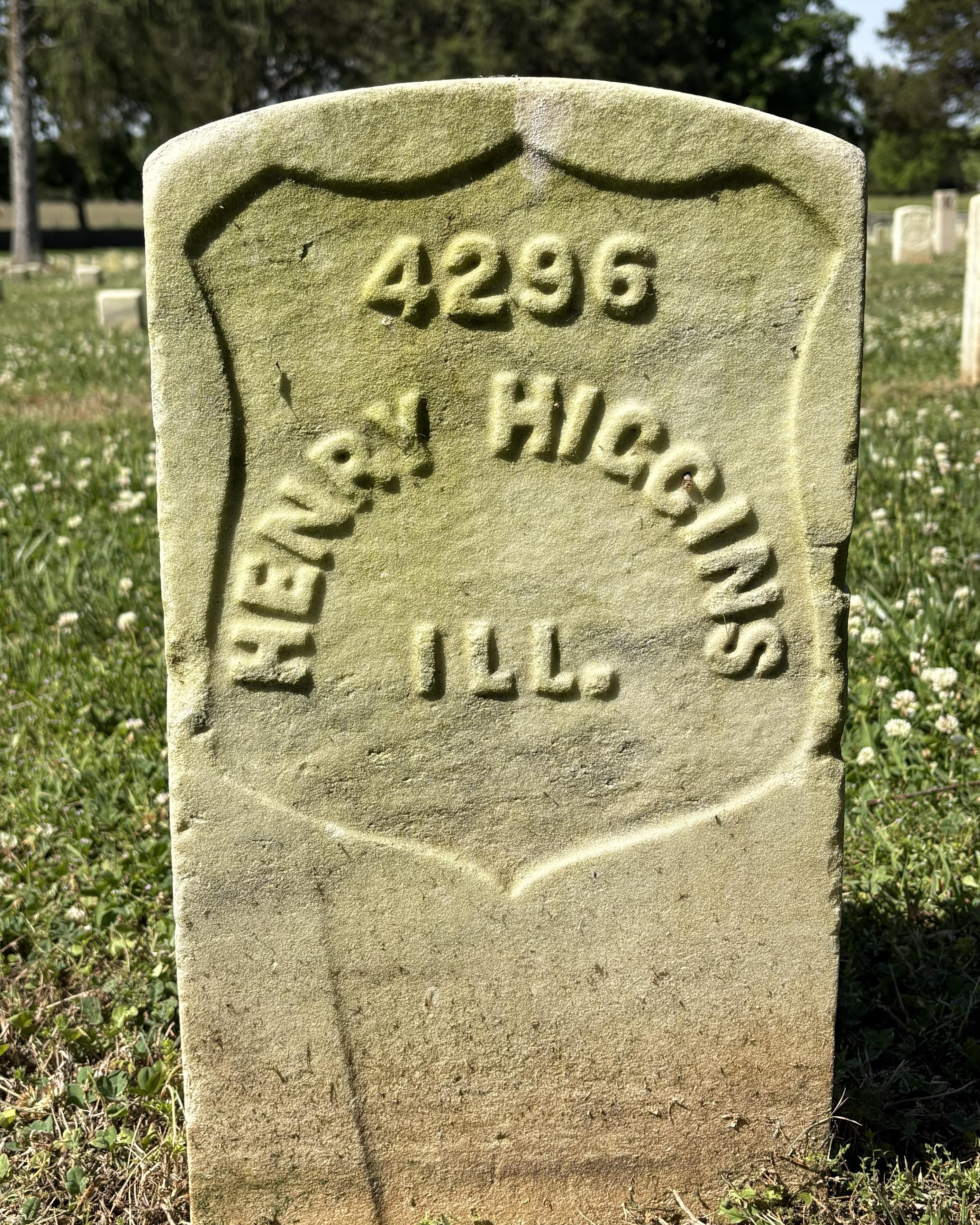 Marble headstone belonging to Civil War soldier Henry Huggins. 