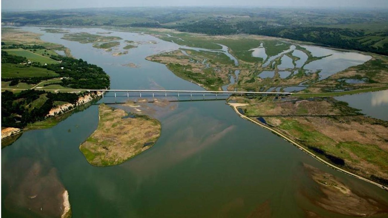 Aerial image of Chief Standing Bear Bridge near Niobrara State Park with sandbars and side channels.