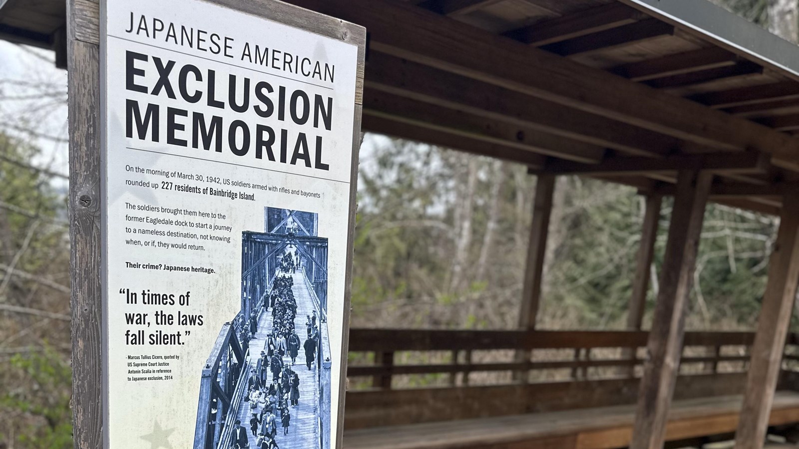 Sign that reads Japanese Exclusion Memorial on a wooden boardwalk.