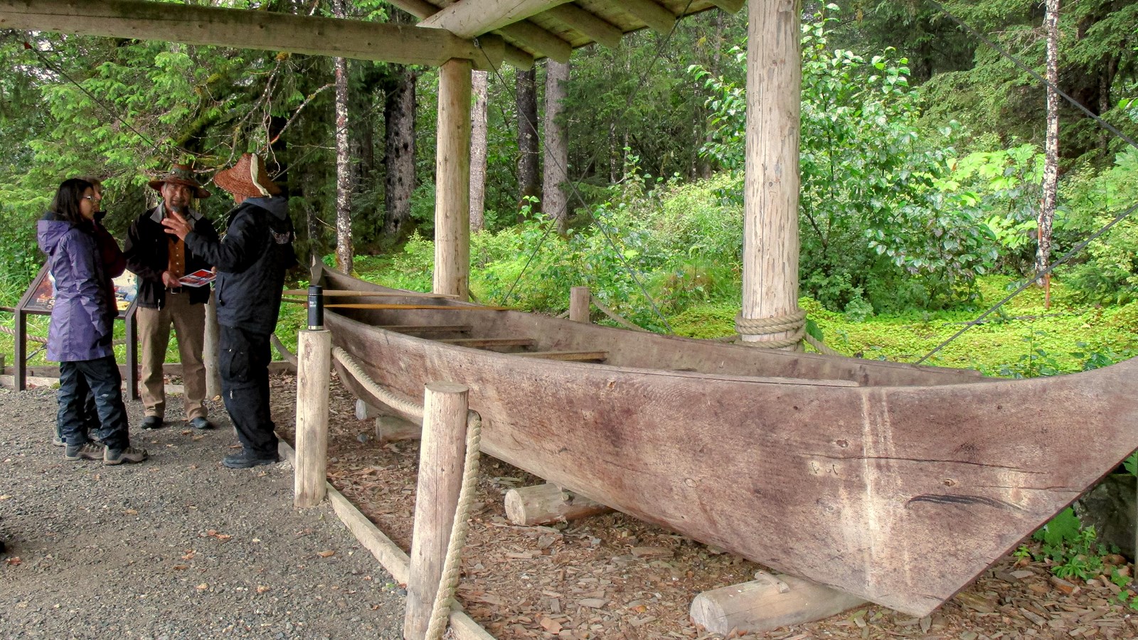 A traditional Tlingit dugout canoe, fashioned from a single log. It sits on display in Bartlett Cove