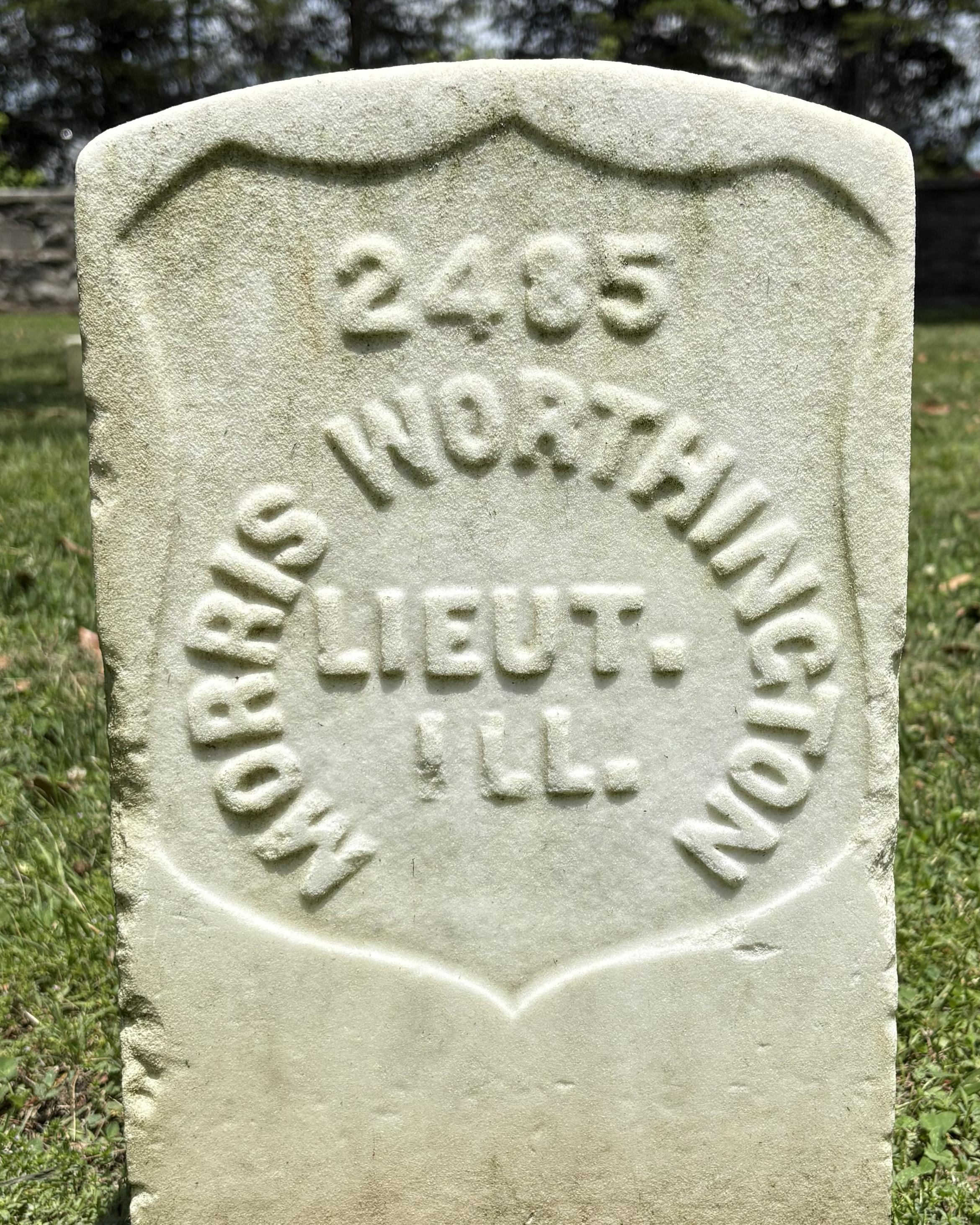 Marble headstone with the name "Morrison Worthington" inscribed on its face. Soldier rank included. 