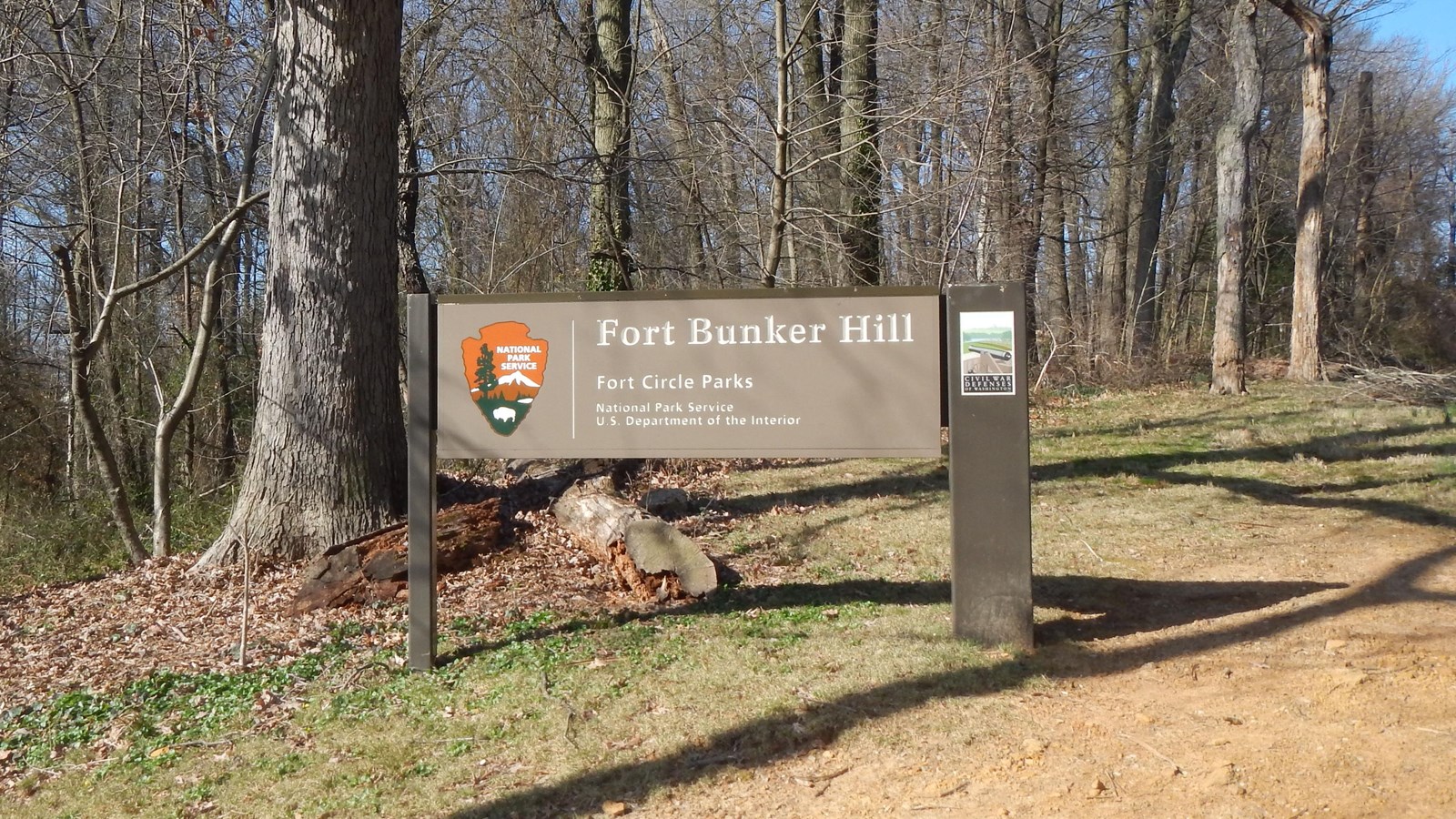 Fort Bunker Hill sign surrounded by trees