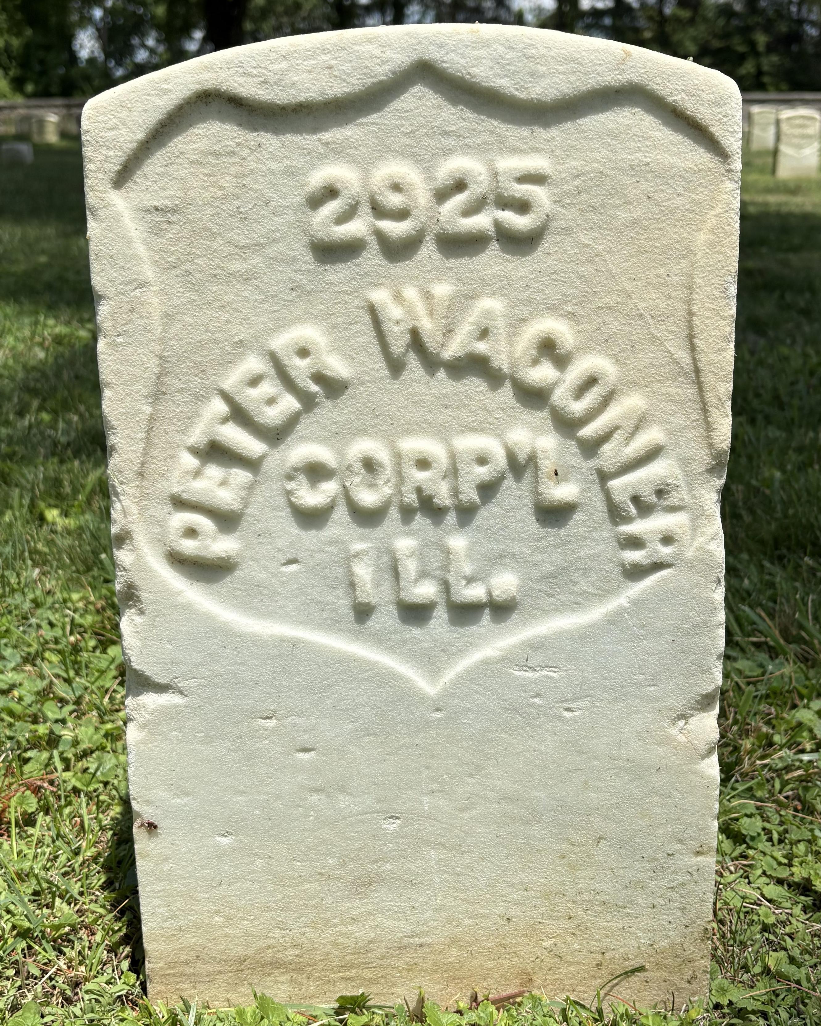 Marble headstone with the name "Peter Wagoner" and the rank "Corp'l" inscribed on its face. 