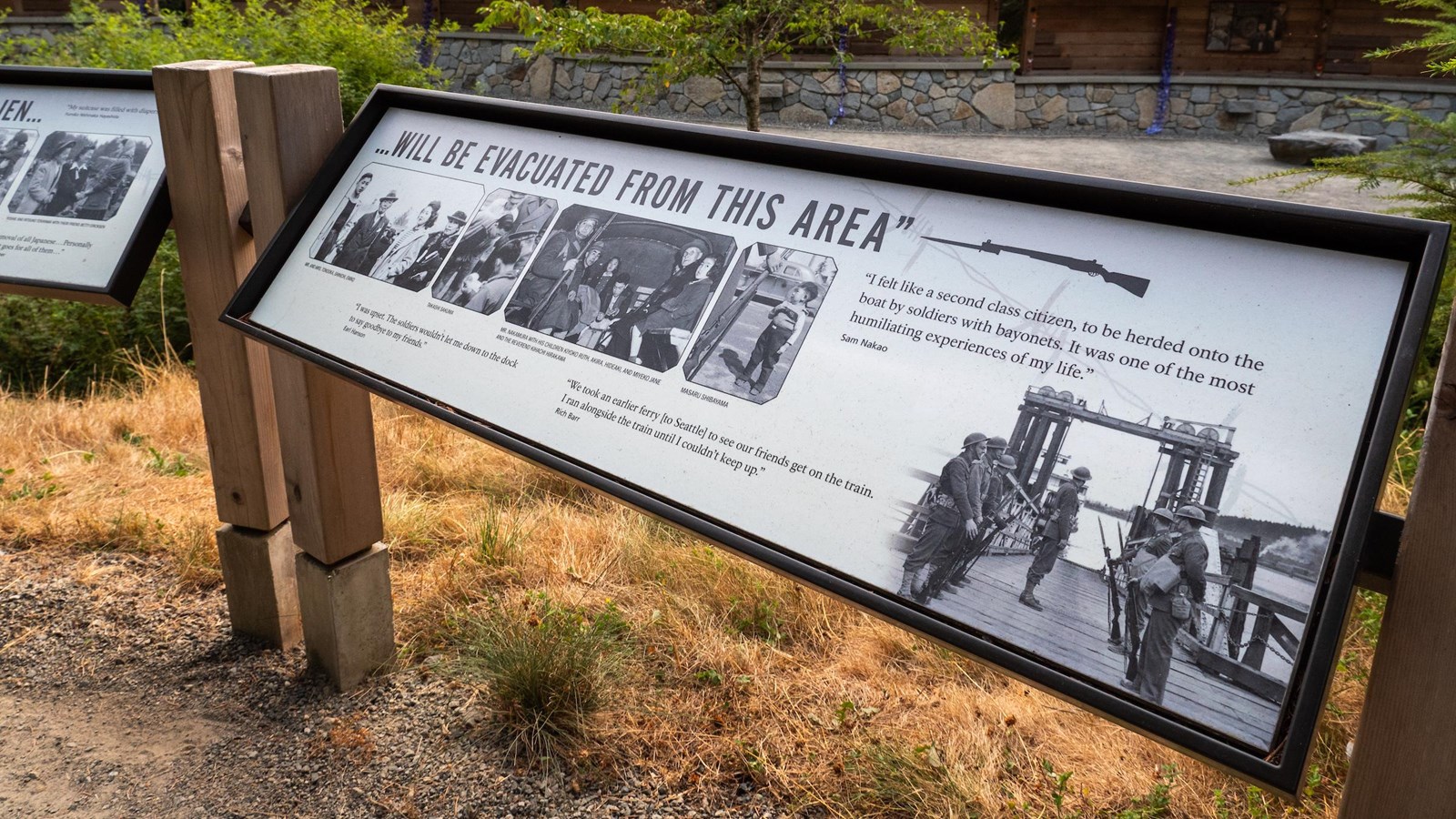 Panel with text and black and white images if soldiers at the departure dock.