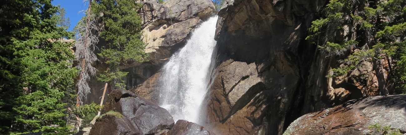 water cascading over a rocky cliff