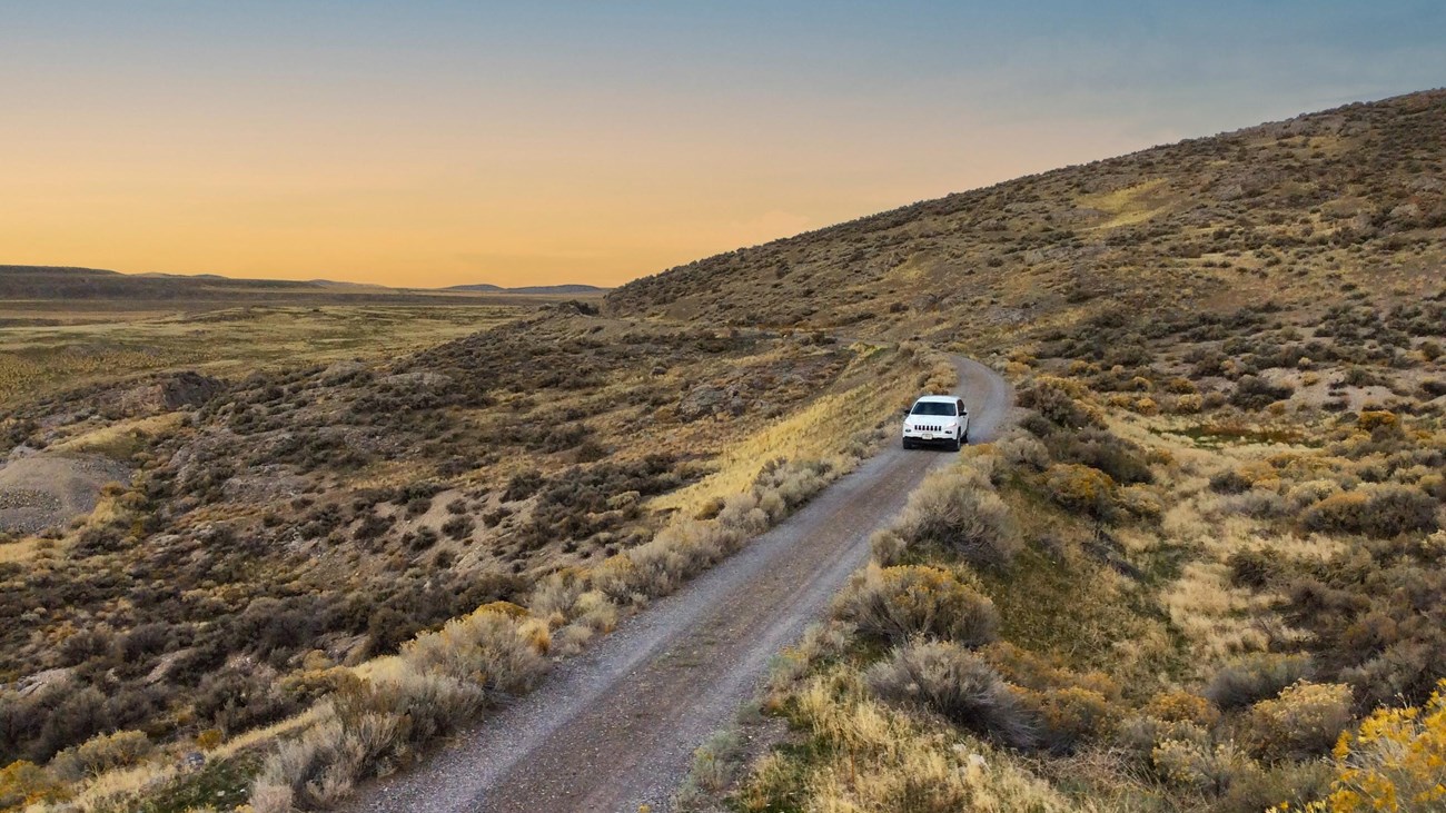 White Jeep driving on the West Auto Tour