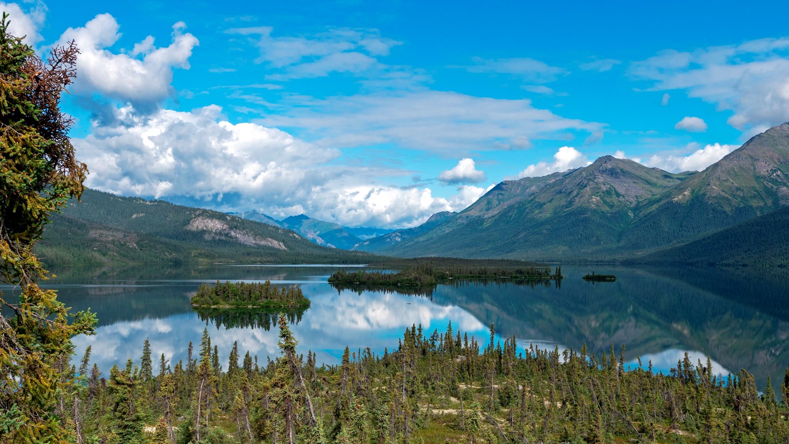 Summer landscape view of islands in Walker Lake and the mountains surrounding it.