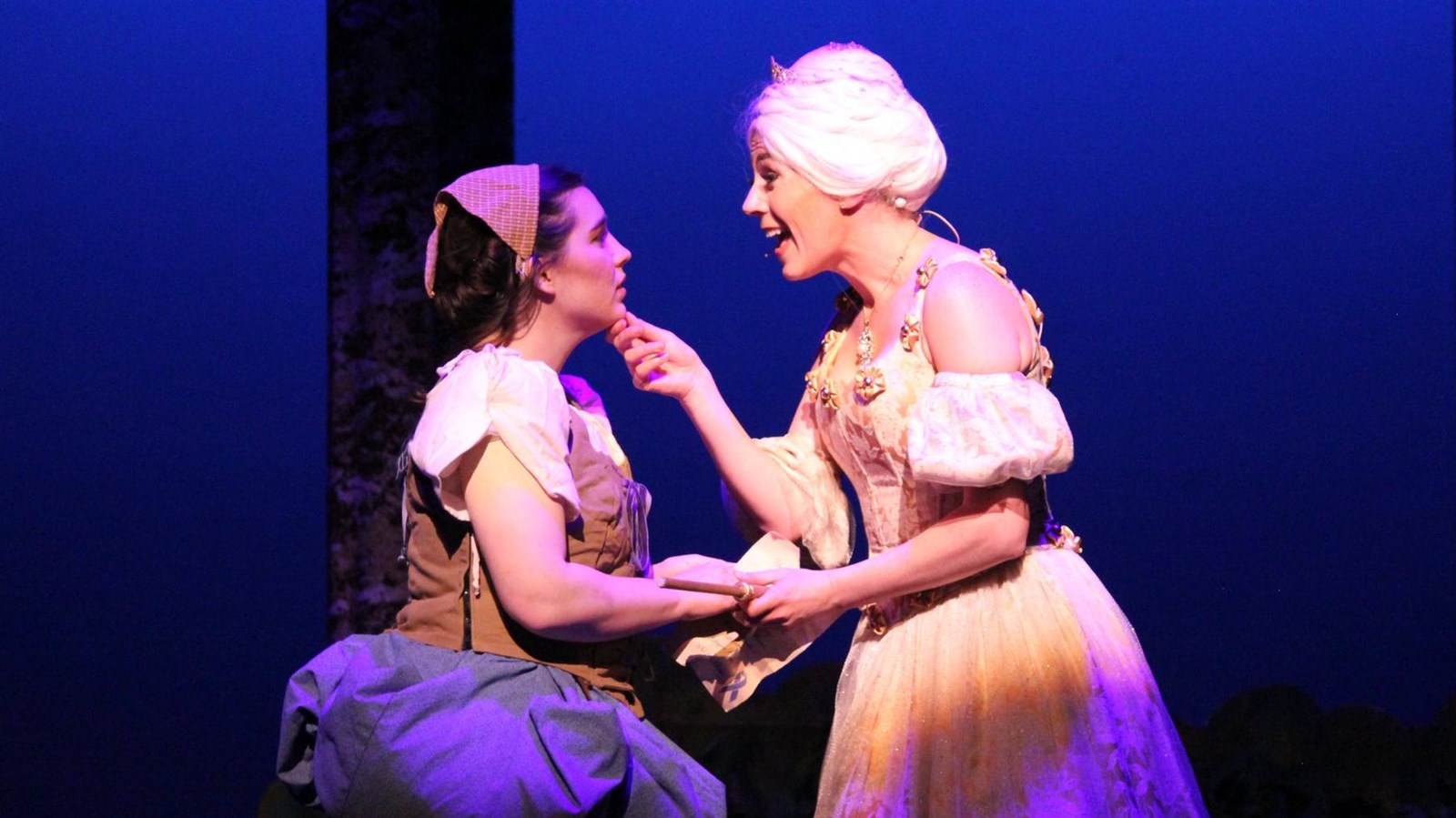 Two women performing on stage