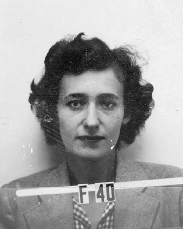 Black and white photo of a woman with short dark hair and identification number F 40.