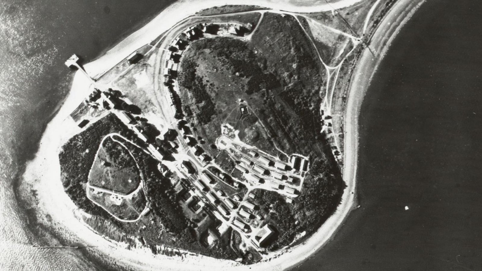 aerial shot looking down on a part of an island with buildings that make up a fort