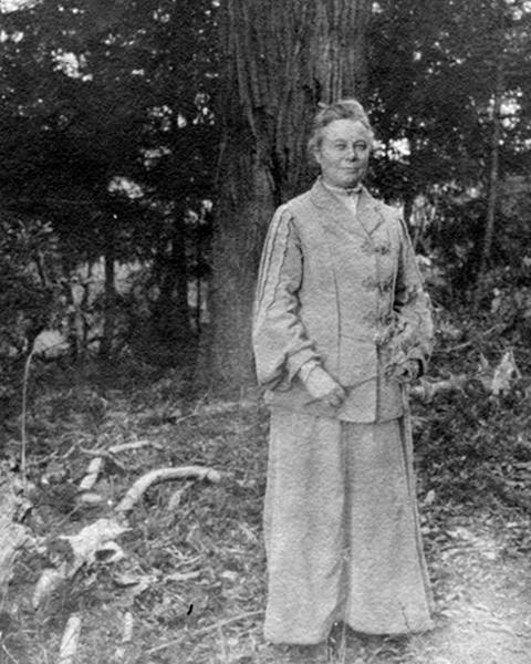 Alice Eastwood in the front of a redwood tree