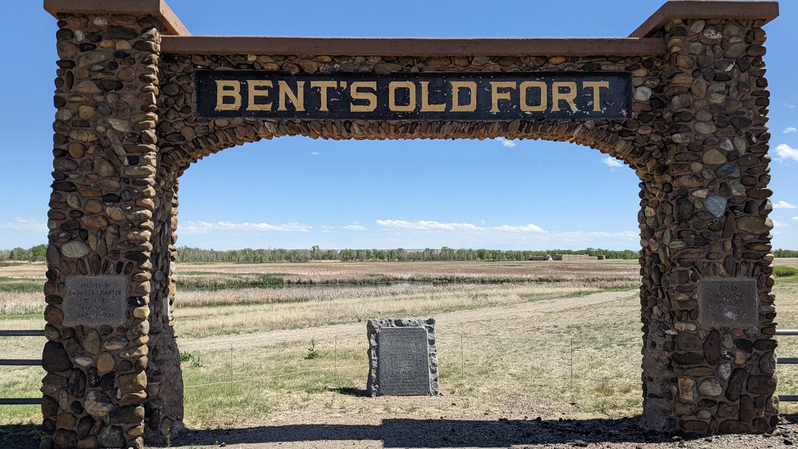 A stone arch with the words 