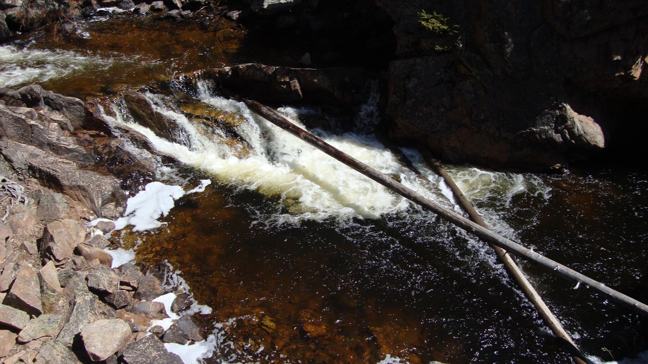 a pool of water with small waterfall