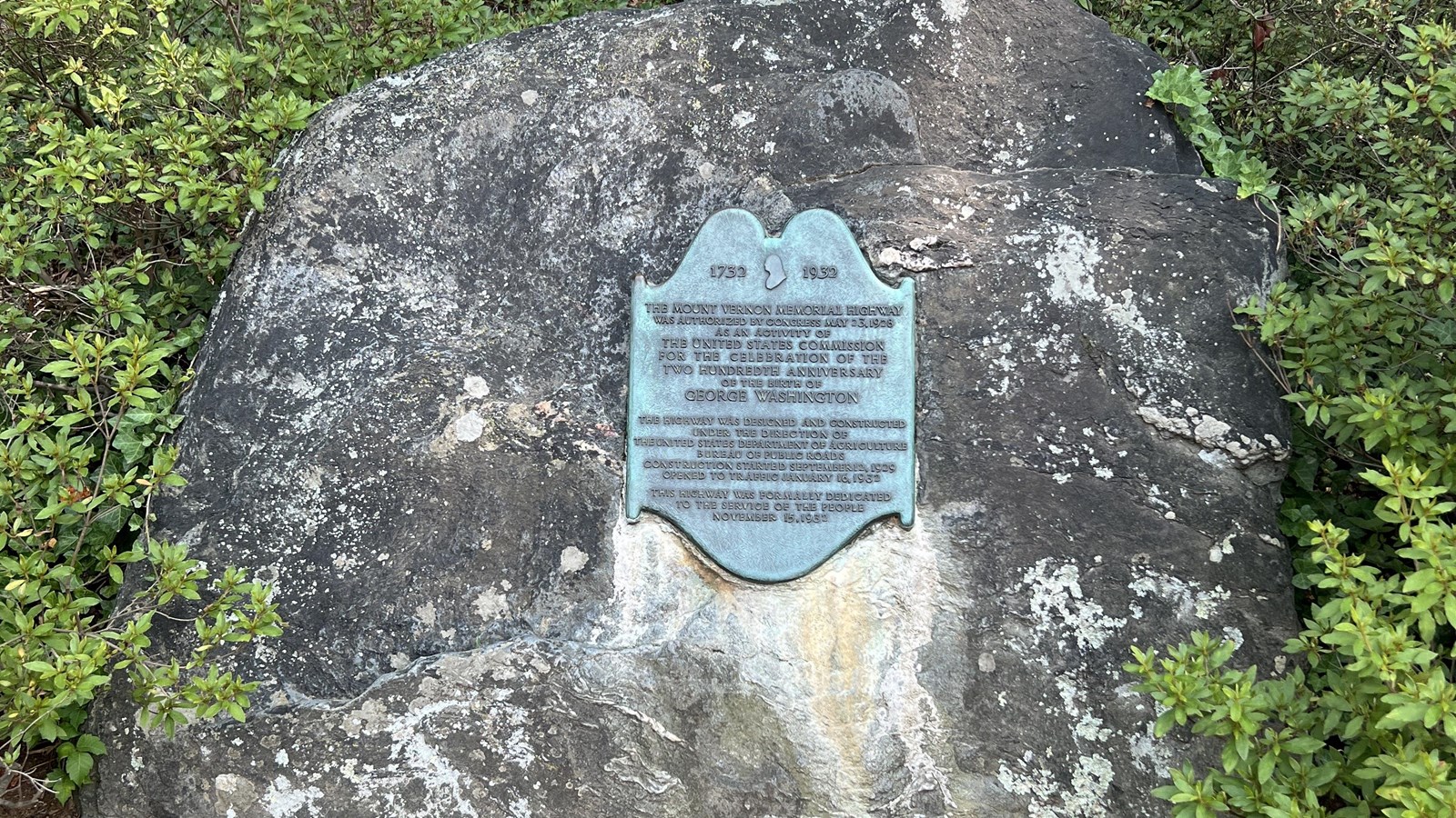 Plaque attached to a boulder