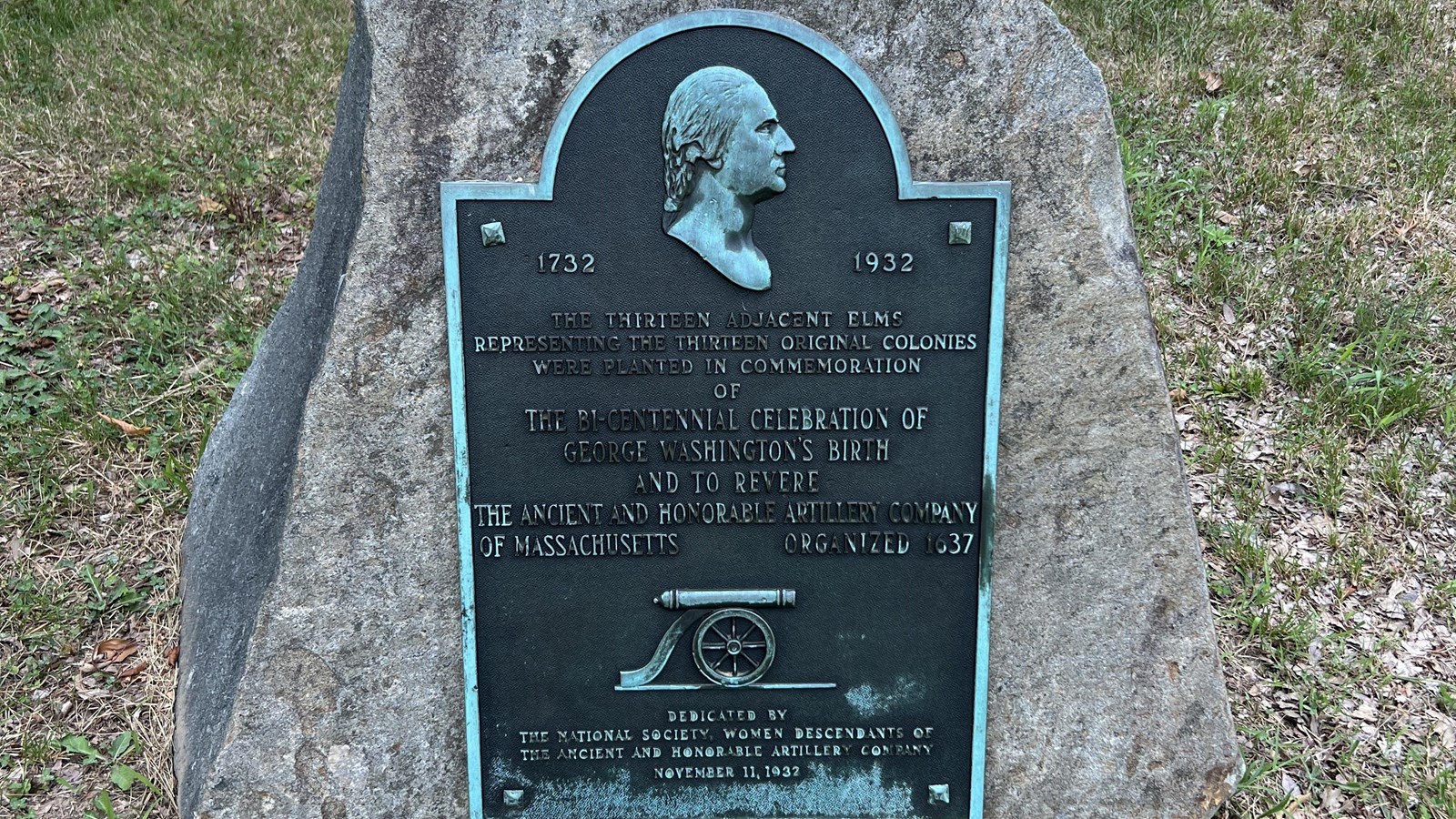 A plaque attached to a boulder