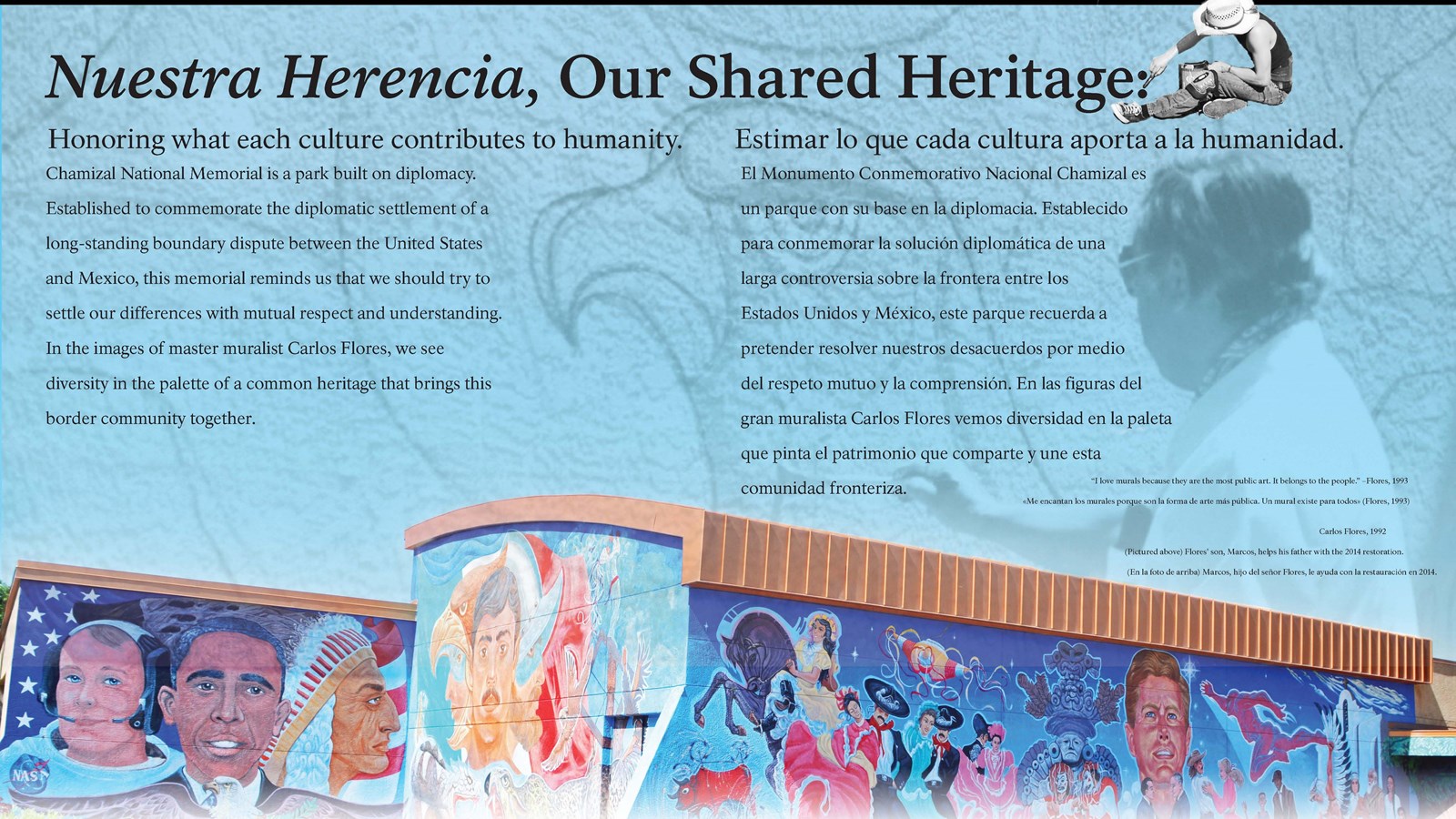 An interpretive panel shows two artists painting and a small depiction of the entire length of mural