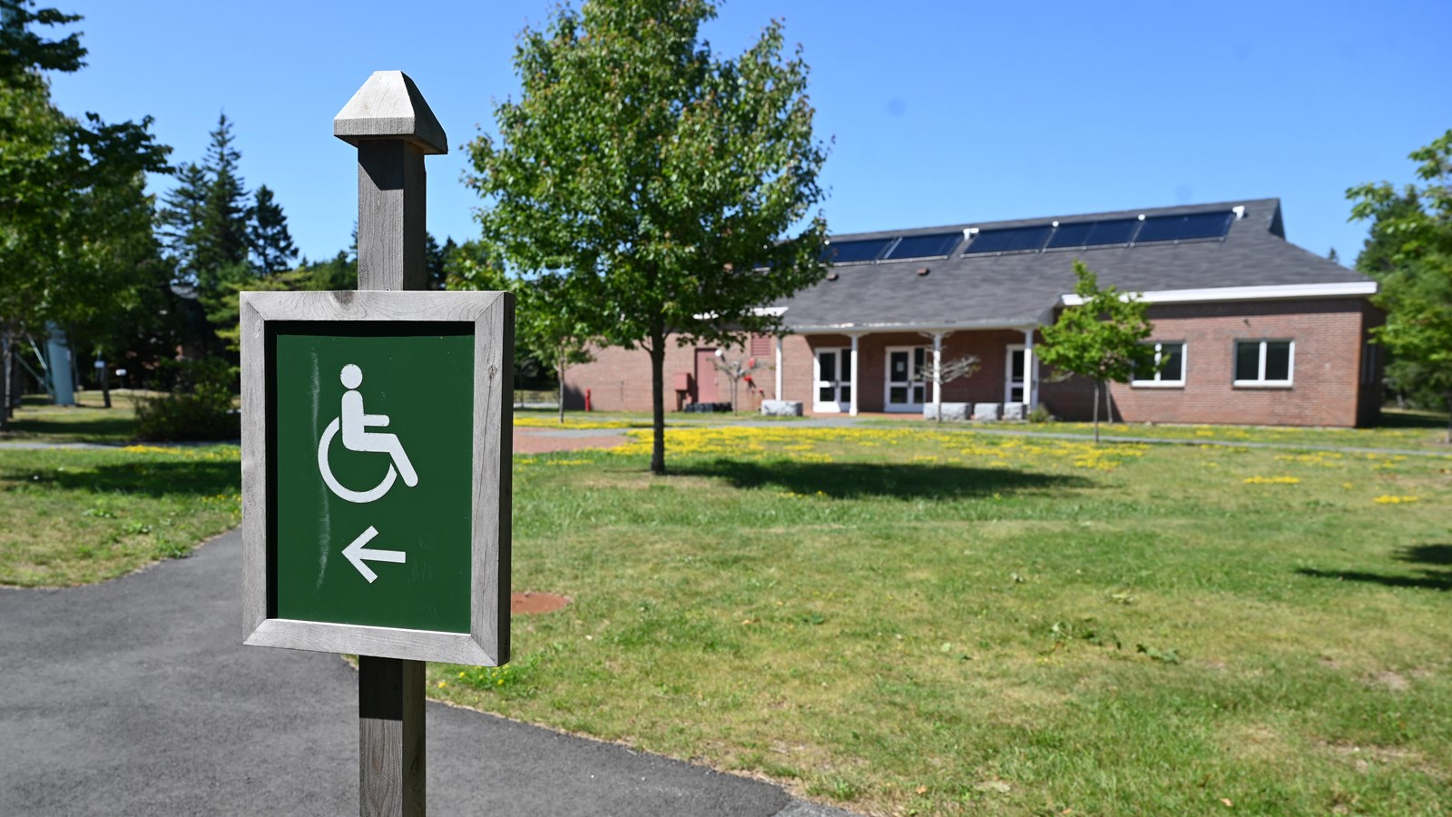a building with a wheelchair symbol on a sign outside 