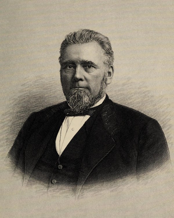 An engraved portrait of a man with short hair and short beard and mustache wearing a suit.