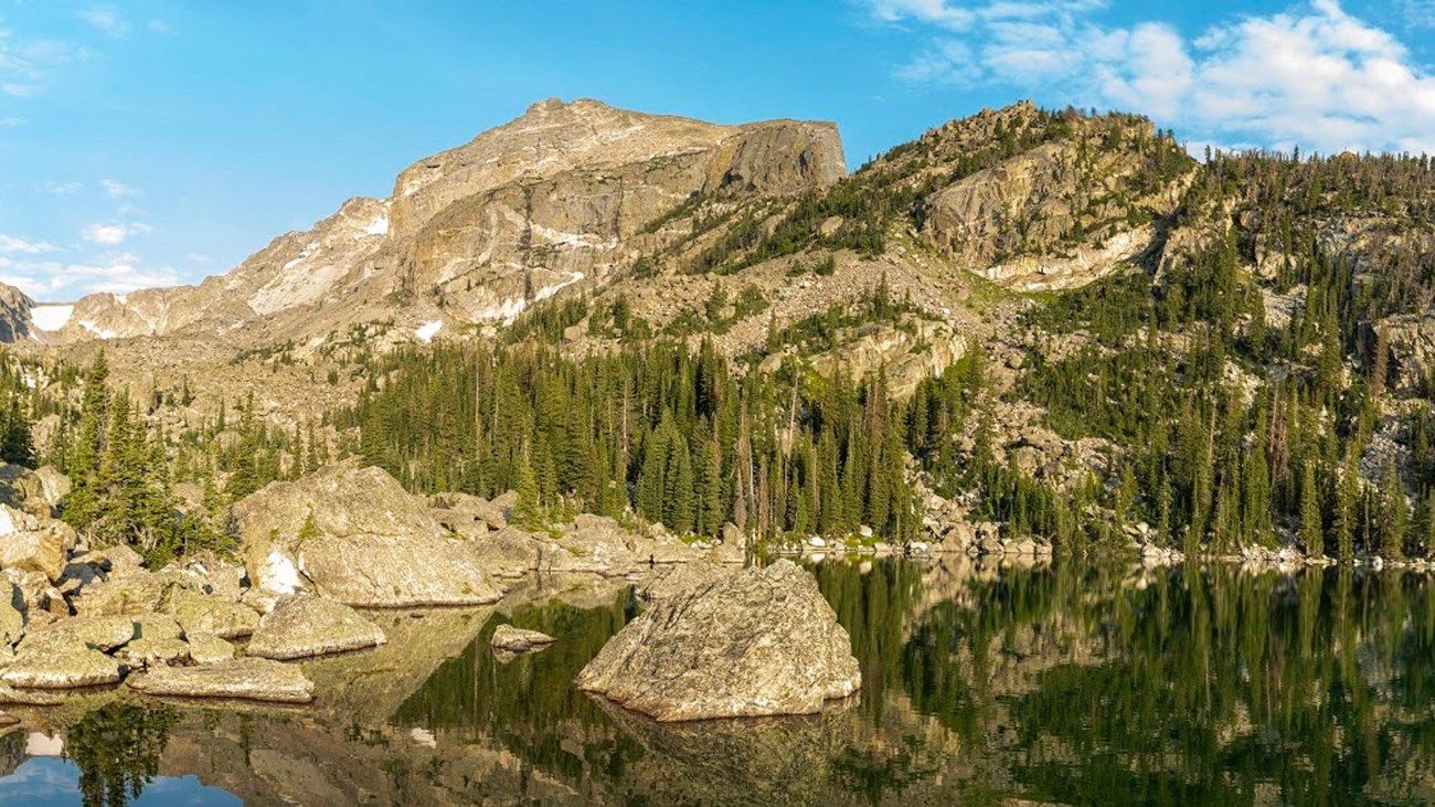 rocky mountains jutting over a lake