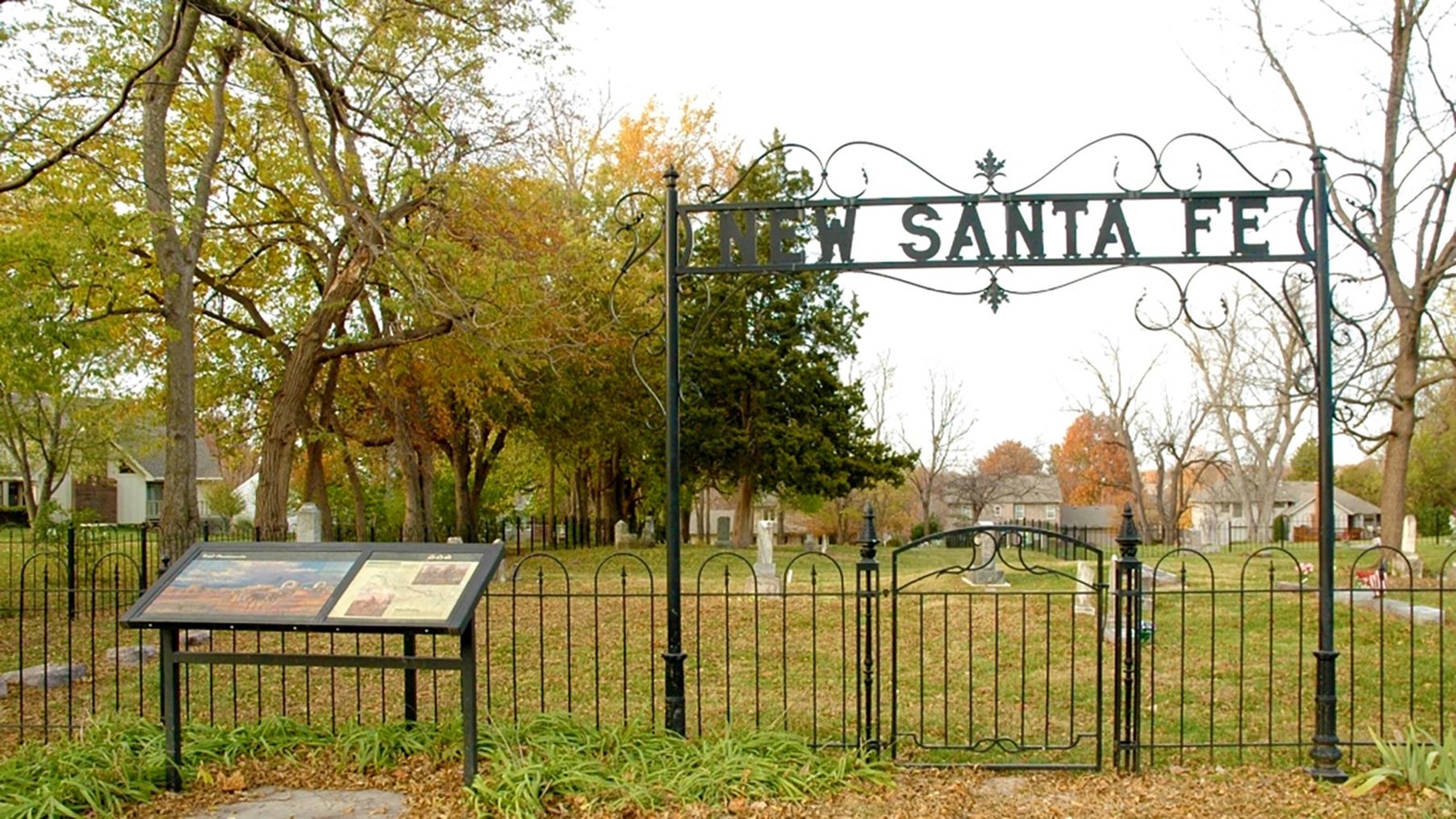 Cemetery entrance with sign reading New Santa Fe