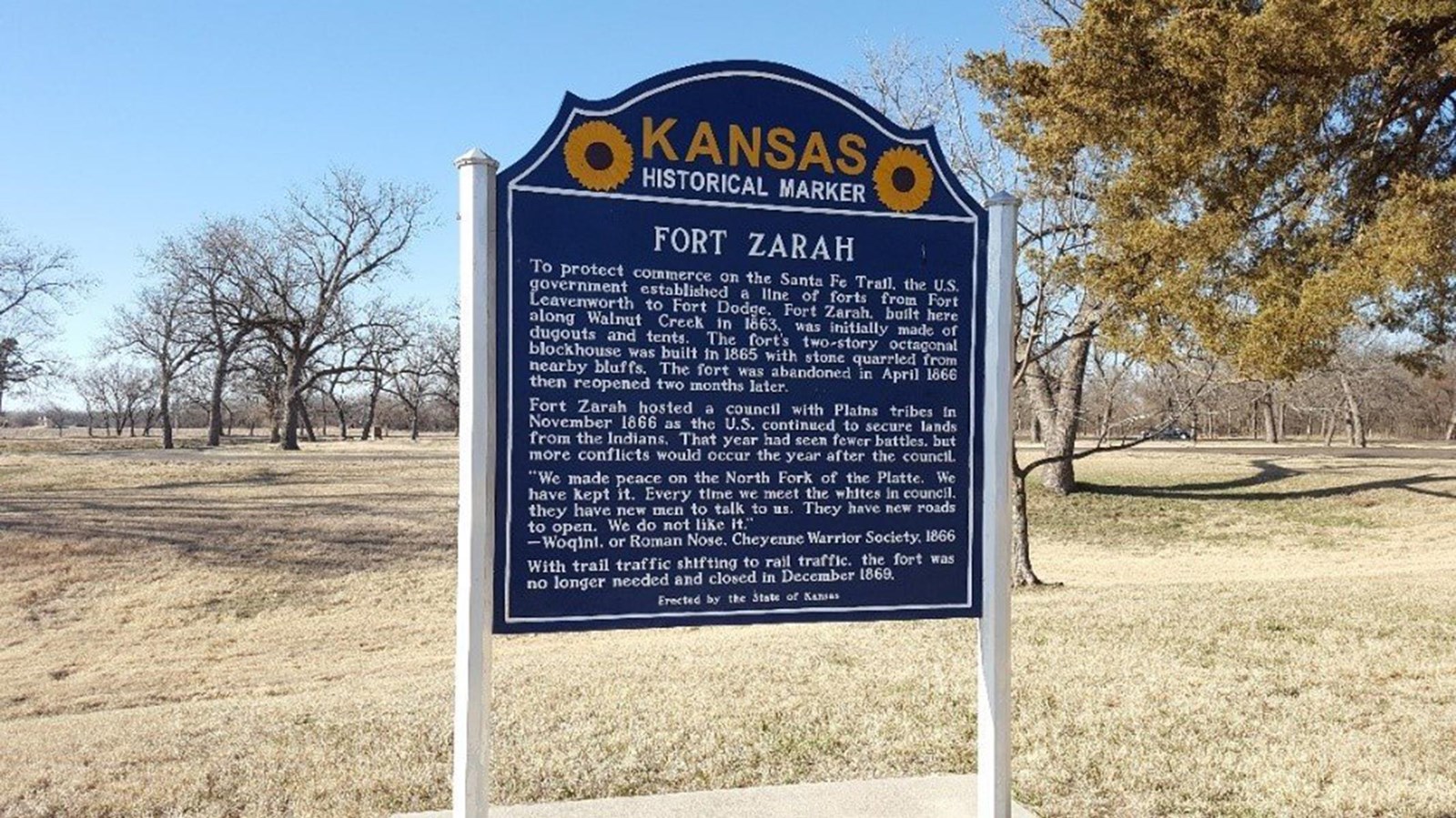 A Kansas Historical Marker in a grassy field