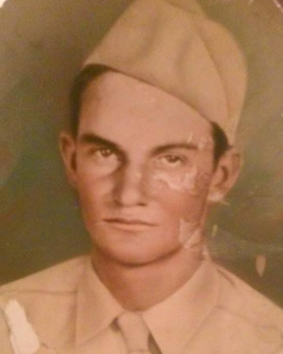Young man in World War II uniform, old tin type photo.