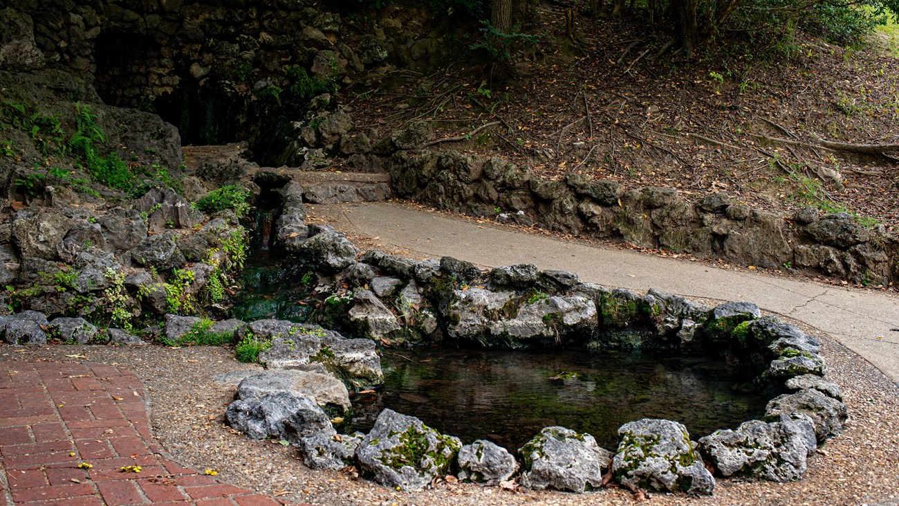 A hot spring with a rock foundation around it.