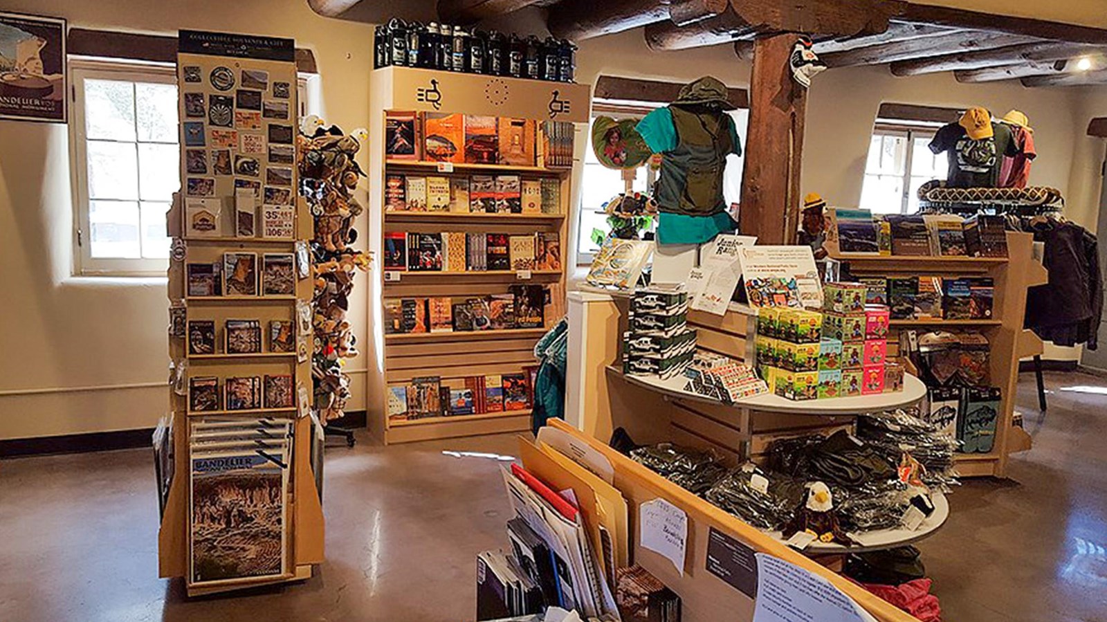 An inside view of a shop with books, magnets, shirts, and other souvenirs able for purchase.