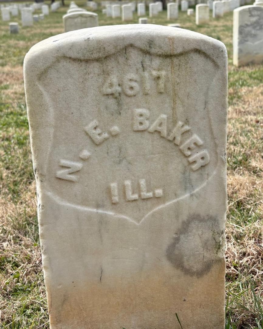 Marble headstone belonging to Nathan Baker.