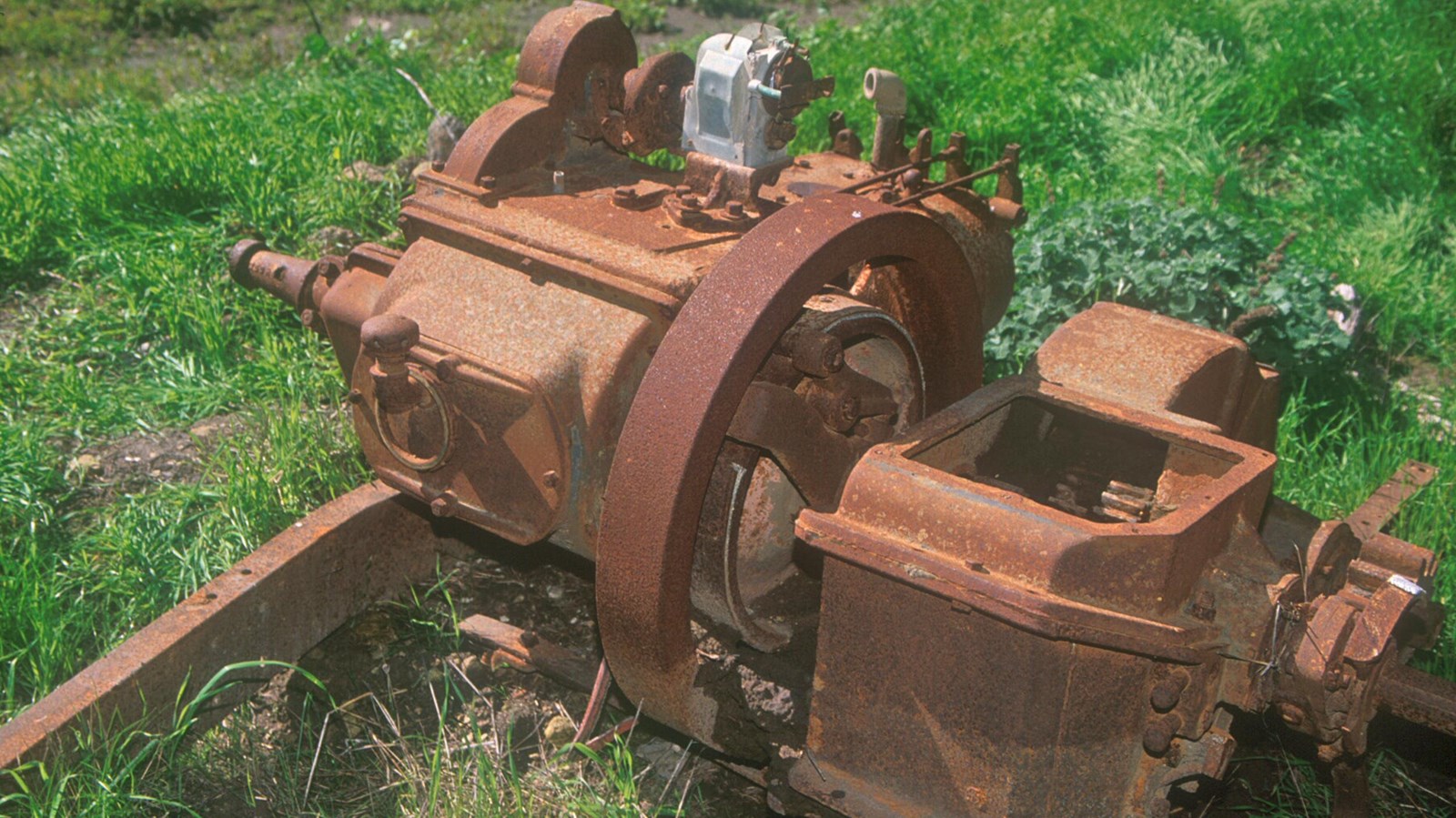 rusted metal of what is left of a tractor.