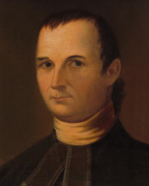 A portrait of a plain looking man with short hair, a clean shaven face, and a minister's collar.