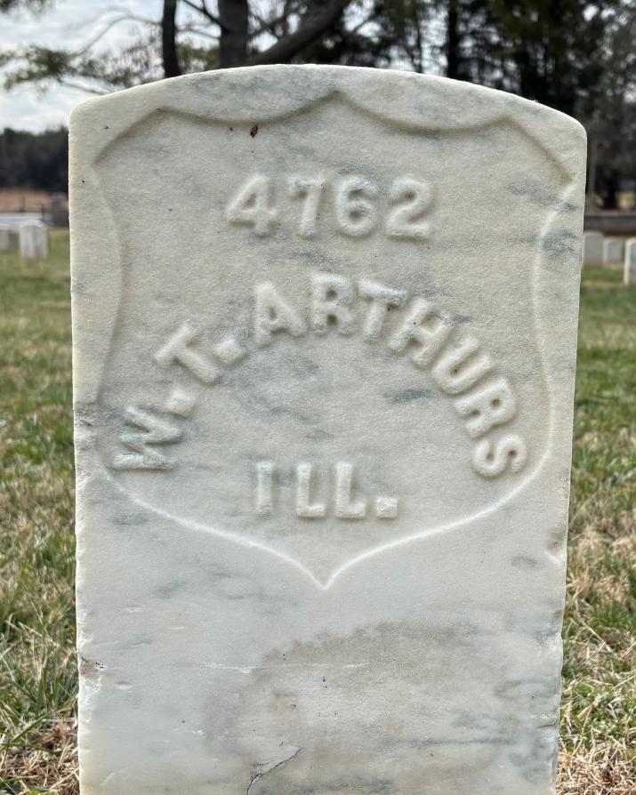 Marble headstone belonging to William T Arthurs. 