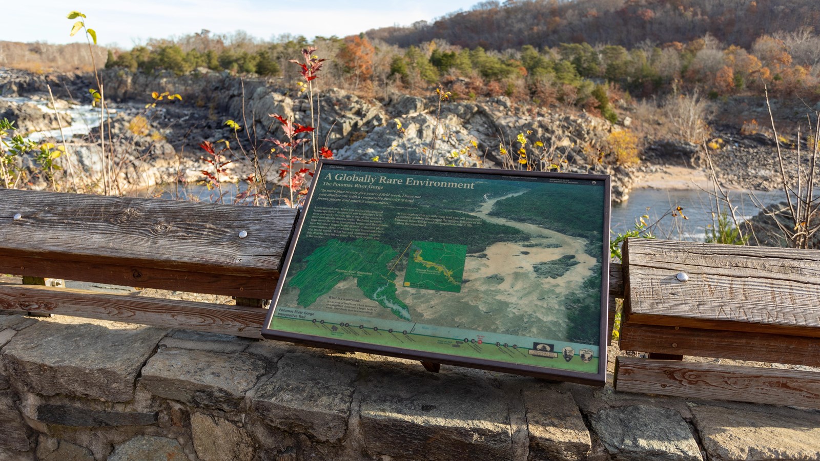 A map of a watershed is displayed on top of a picture of white water flowing over rocks.