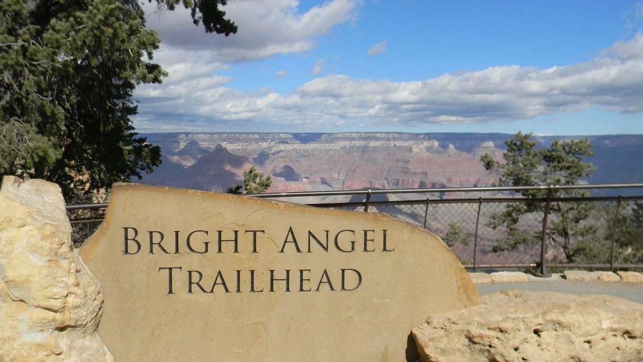 A large stone sign reads 